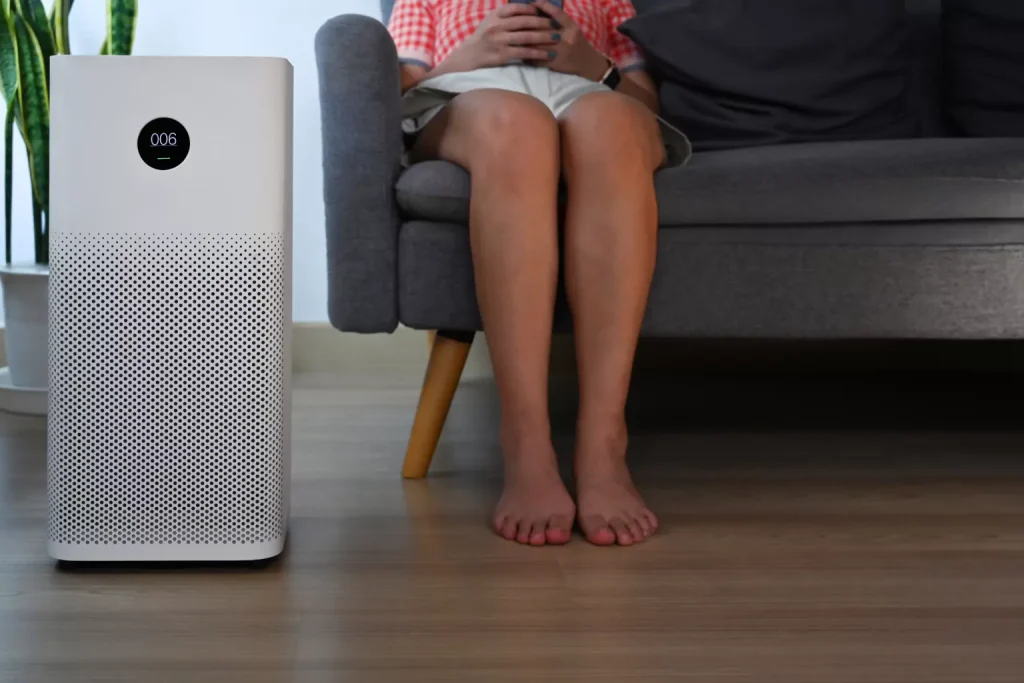 Air filter next to woman