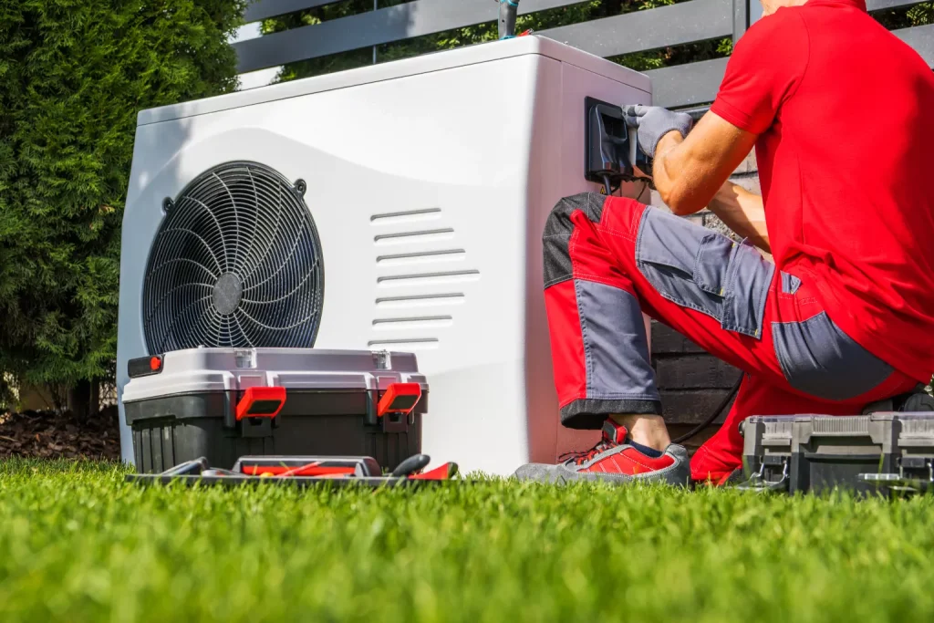 Hvac worker repairing heat pump